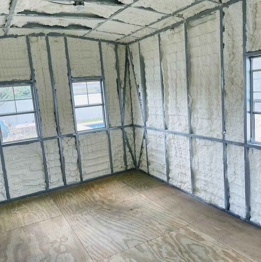 Closed-cell spray foam insulation applied to wall cavities in a residential project in Cohoes
